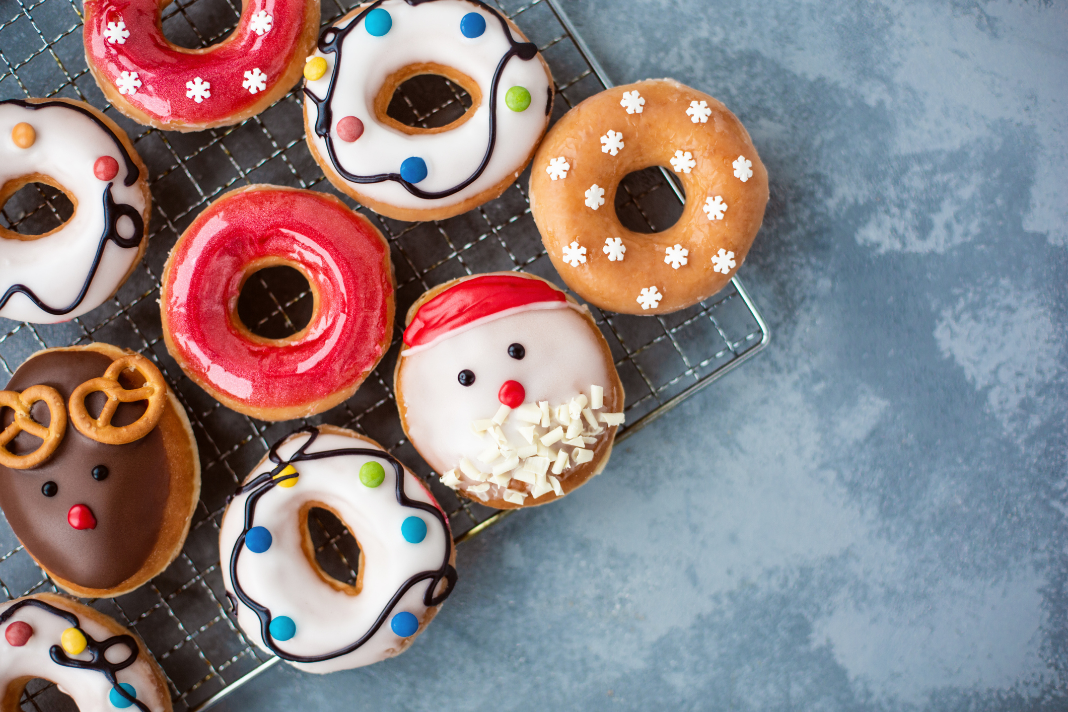 Christmas home made donuts served on baking sheet on concrete table. Copy space. View from the top. Close up.